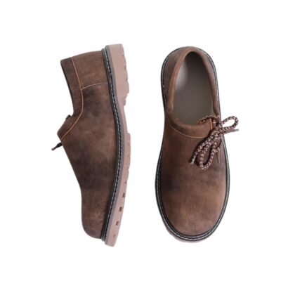 Bucktrail Lederhosen Shoes displayed in a flat lay showing the side profile and top view, highlighting the earthy brown suede material and detailed stitching.