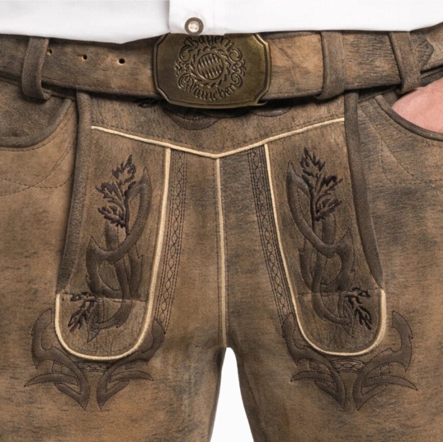 Close-up of Bavarian Heritage leather flap showing intricate brown vine embroidery