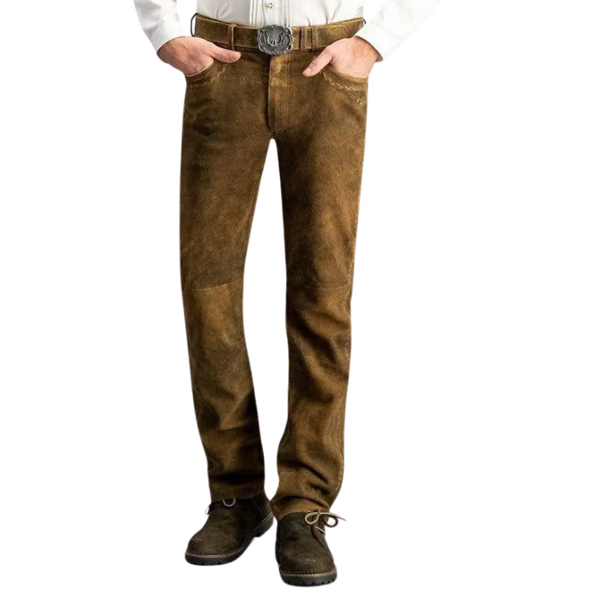 Front view of a man wearing brown full-length lederhosen with both hands in pockets, styled with a white shirt and dark shoes.