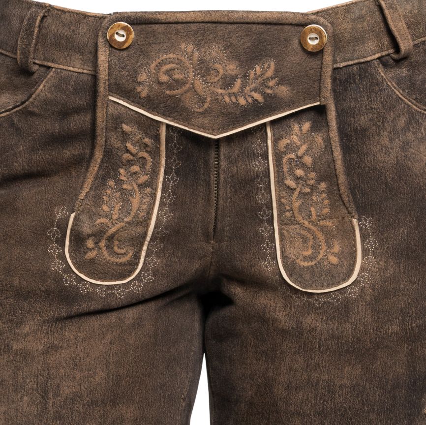 Closeup of the front flap of brown women's lederhosen, showcasing intricate traditional embroidery and horn-style buttons.