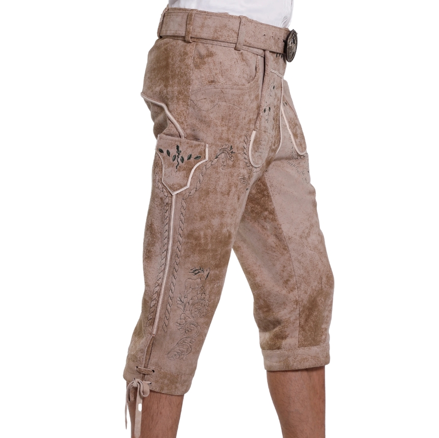 Angled side view of beige traditional Bavarian bundhosen highlighting the detailed floral embroidery, antique piping, and side pocket accents.
