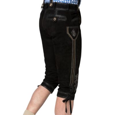 Angled side view of black Bavarian bundhosen displaying an embroidered side pocket flap, dual seam embroidery, and traditional calf lacing.