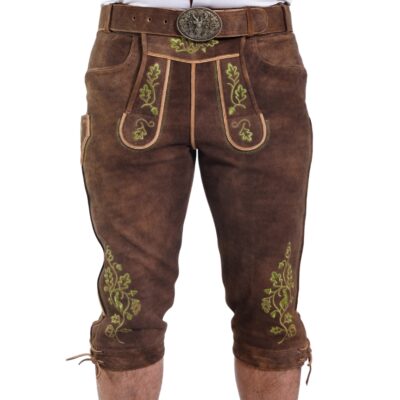 Brown knee-length Bavarian lederhosen with vibrant green oak leaf embroidery and ornate front flap