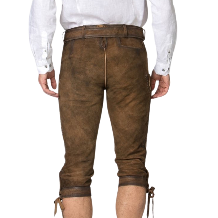 Rear view of traditional chestnut brown leather bundhosen featuring a natural suede texture, center seam, belt loops, and tie closures around the knees.