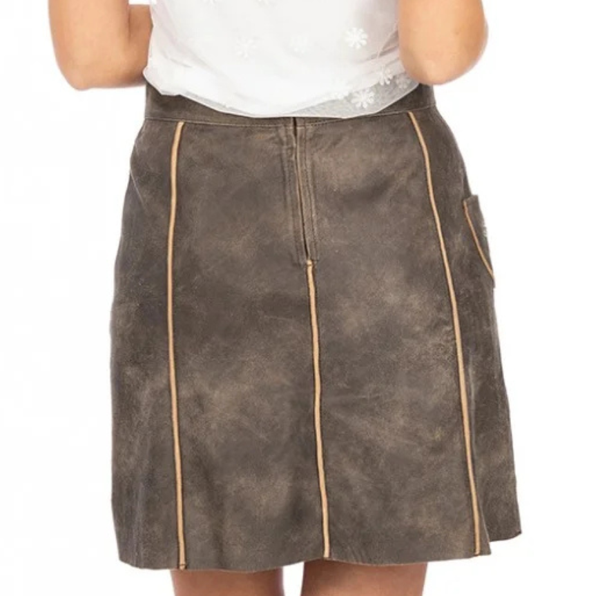 Rear view of a traditional German leather skirt with a zipper closure and contrasting beige seam piping on rustic brown suede.