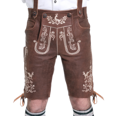 Front closeup of brown traditional lederhosen shorts with intricate cream embroidery, side pockets, and a flap with buttoned braces.