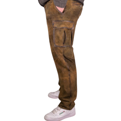Right side view of men's cargo-style lederhosen made of distressed brown leather, highlighting the oversized pocket and relaxed fit.