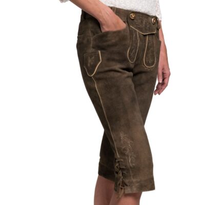 Side view of traditional women’s brown capri-length lederhosen with cream piping, side pocket with flap, embroidered floral detail on the thigh, and lace-up cuffs.