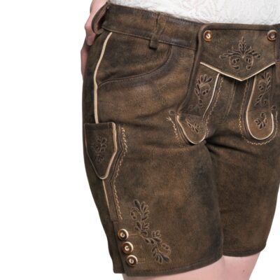 Side view of brown suede women's lederhosen shorts with beige embroidery, decorative buttons on the leg, and a small side pocket with flap closure.