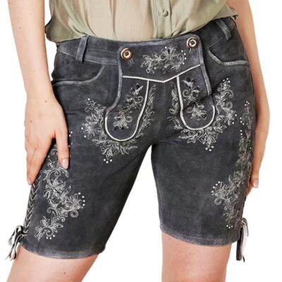 Woman wearing grey suede embroidered lederhosen shorts, front-facing, with white floral patterns and decorative flap design at the waist.
