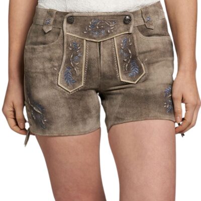 Front view of women’s traditional taupe lederhosen shorts, detailed with floral and vine embroidery in blue, white piping along the flap, and decorative horn buttons.