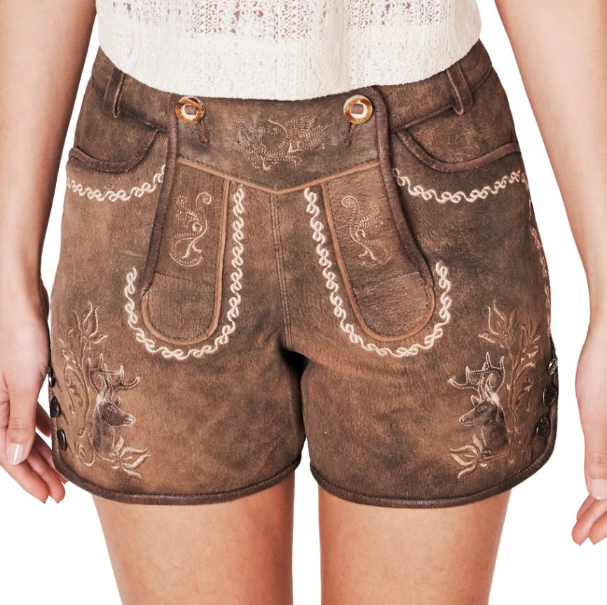 Front view of women's brown suede lederhosen shorts with white embroidery, traditional flap detail, and stag head motifs on both thighs.