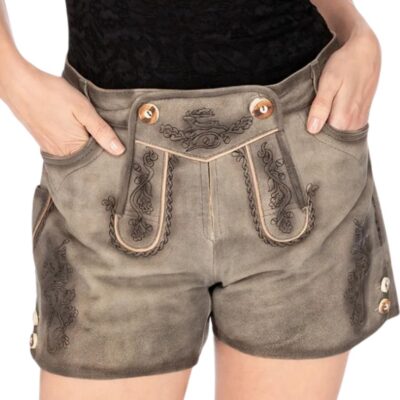 Woman wearing rustic gray leather shorts with hands in pockets, highlighting the traditional embroidery and button details, paired with a black lace top.