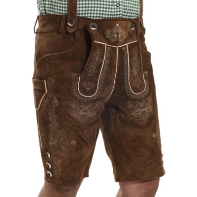 Model wearing Bavarian lederhosen in medium brown with suspenders and ornate embroidery