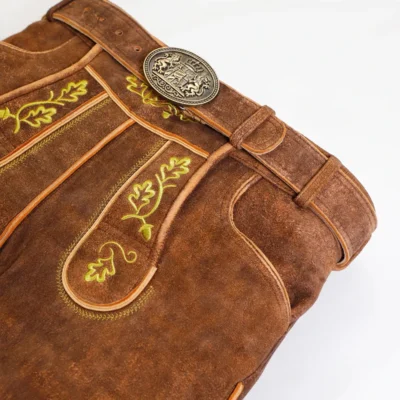 Close-up view of premium brown Bavarian lederhosen embroidery and belt